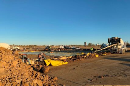Retail concrete construction project with mixing truck